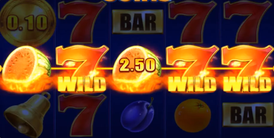 Slot machine reels featuring glowing red 7 WILD symbols, fruit icons, BAR signs, and gold coins against a dark blue background.